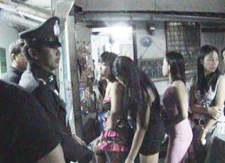 Police check workers at a local entertainment complex during their foray around Pattaya’s nightspots last Friday.
